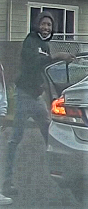Suspect_1_Standing_outside_car.png