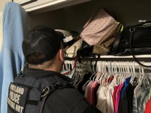 officer_searches_closet.jpg